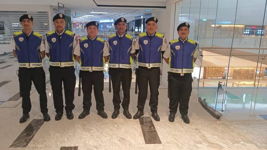 Six G.Garuda officers on duty in a shopping mall concourse